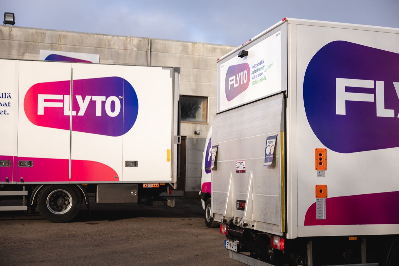 Two Flyto trucks parked and ready for transport